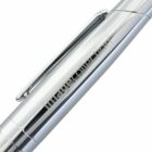 Close-up of a sleek, silver metallic pen with a clip and engraved text reading Image Collection. The pen reflects light, highlighting its smooth, polished surface.