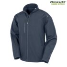 Dark gray zip-up jacket with a high collar and two zippered side pockets. Theres a chest pocket with a zip and a recycled logo text in the top right corner.