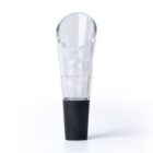 A clear plastic wine pourer with a sleek, slanted spout attached to a black rubber stopper, designed to fit into a wine bottle for easy pouring. The pourer is vertically positioned on a plain white background.