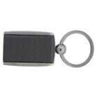 Rectangular black keychain with a subtle grid pattern and metallic edges, attached to a circular metal keyring. The design is sleek and modern.