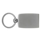 A metallic keychain with a round keyring attached to a rectangular, flat plate. The surface of the plate is smooth and unadorned, reflecting light subtly. The overall color is a muted silver or steel gray.