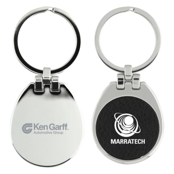 Two metallic keychains are shown. One has the Ken Garff Automotive Group logo, and the other features the Marratech logo with a stylized planet design. Both keychains are oval-shaped with hinges and rings for keys.