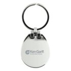 Silver oval keychain with Ken Garff Automotive Group logo. The keychain features a polished surface and is attached to a round metal ring.