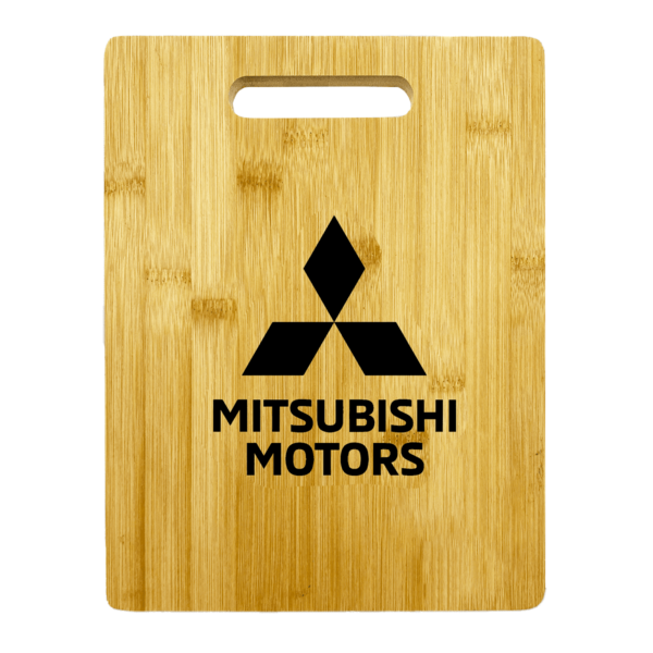 Wooden cutting board featuring the black Mitsubishi Motors logo and text in the center. The board has a rectangular shape with a handle cutout at the top.