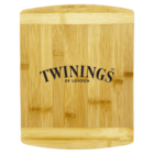A wooden cutting board featuring the Twinings of London logo in black text. The board has a smooth finish with natural wood grain patterns visible.