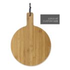 Round wooden cutting board with a handle and a black loop for hanging. Text indicates LOGO AT CUSTOM SIZE suggesting space for customization. The board has a natural wood grain texture.