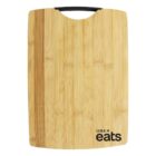 A wooden cutting board with a black handle at the top. The board features the Uber Eats logo in black text at the bottom right corner.