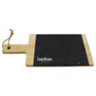 A wooden cutting board with a black slate panel on the right side. It has a handle with a hole and a rope loop. The words TarraWarra Estate are printed on the slate section.