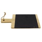 A rectangular wooden cutting board with a handle and a hole for hanging, featuring a black slate insert in the center. A rope is tied through the hole in the handle.