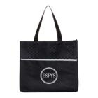 A black tote bag with two handles. The top section has a textured pattern, and below it, a reflective strip. The bottom section displays THE ESPYS logo in white text within a circle.