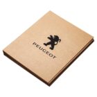 A stack of brown folders with the Peugeot logo, a stylized lion, and the word Peugeot printed in black on the front folder.