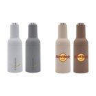 Four insulated bottles stand side by side. Two on the left are white and gray with Chandon branding, and two on the right are beige and brown with Hard Rock Cafe logos.