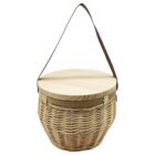 A round wicker basket with a wooden lid and a brown leather strap handle. The baskets woven design features a natural beige color, while the wooden lid appears smooth and polished.
