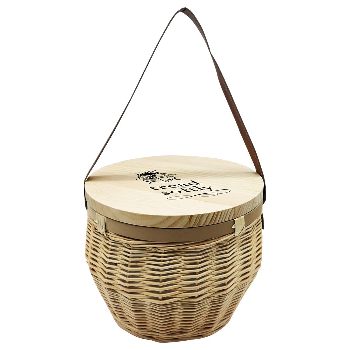 A round, woven basket with a flat wooden lid and a brown leather shoulder strap. The lid features a design with text that reads treat toky. The basket has a natural beige color.