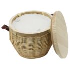 Wicker basket with a round wooden lid, open to reveal a light fabric lining inside. The basket has a leather handle on one side.