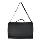 A black, foldable travel bag hanging by its adjustable strap. The bag has a smooth, rectangular flap and a handle on top, designed for convenience and portability. The simple design suggests practicality for storage or travel use.