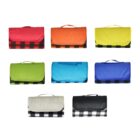 Eight folded picnic blankets in various colors: red, yellow, green, blue, and black, each with a checkered pattern and handle, arranged in two rows on a white background.