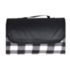 A neatly folded picnic blanket with a black flap cover and a handle. The blanket features a black and white checkered pattern.