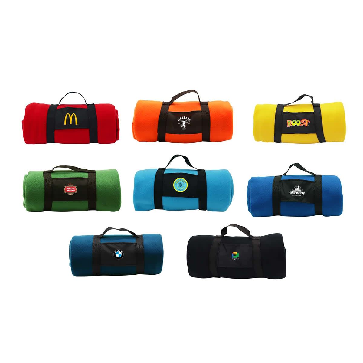 A collection of rolled-up blankets in various colors, each with a different logo. They have black straps for carrying, and the colors include red, orange, yellow, green, blue, and black.