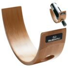 Curved wooden wine bottle holder with Subaru logo, balancing a bottle. Inset shows a closer view of the bottle in the holder.