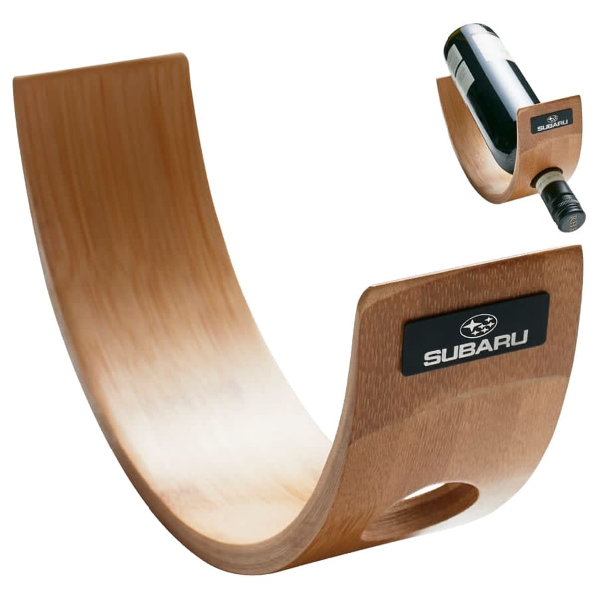 Curved wooden wine bottle holder with Subaru logo, balancing a bottle. Inset shows a closer view of the bottle in the holder.