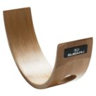A curved wooden object with a smooth finish, resembling a rocking chair base. It has a black label with a star logo and the word Subaru on one side. The curved design includes a handle cutout at the bottom edge.