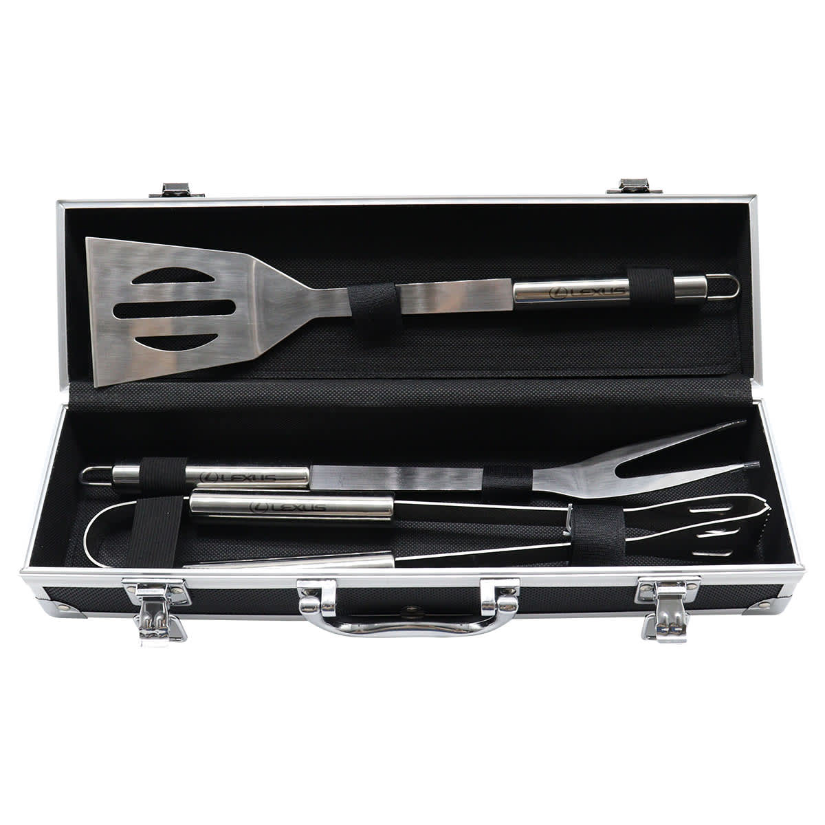 A set of stainless steel grilling tools in a black carrying case with a handle. The tools include a slotted spatula, tongs, and a fork, all secured with elastic straps inside the case.