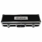 A black rectangular carrying case with metallic edges and corners, featuring a metal handle and two clasps. The top has a metal plate with the Lexus logo and text.
