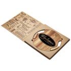 A wooden cheese board set in a cardboard box. The board features a dark emblem reading Merlottes Bar and Grill. The packaging is decorated with food-related words and graphics, such as gourmet, premium quality, and aged cheddar.