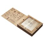 Wooden cheese board with a sliding lid partially open, revealing an etched cutting surface featuring a pair of sunglasses and text. The lid has various cheese-related words and graphics printed on it, emphasizing quality and selection.