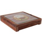 A wooden cigar box with a glass top featuring a circular logo. The logo includes the text Music Cafe & Grill and the image of a guitar. The box has a smooth finish and a rectangular shape.