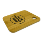A wooden cutting board with a hole in the top right corner for hanging. It has the words YOUR BRAND HERE printed in black within a circle in the center.