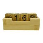 A wooden perpetual calendar with three blocks. The blocks display AUG, 16, and MON, representing a date in August. The blocks and holder are made from light-colored wood.