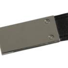 A close-up of a rectangular metallic belt buckle with two rivets, attached to a black leather strap. The buckle has a shiny, reflective surface.