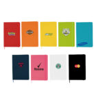 Nine colorful notebooks arranged in two rows, each featuring different logos such as Pokémon, Subway, Samsung, Rexona, and more. The notebooks are red, orange, yellow, green, blue, pink, white, and black.