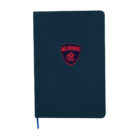 A dark blue notebook with rounded corners features a red Melbourne emblem at the center. A thin blue ribbon bookmark is visible at the bottom.