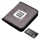 Gray zippered binder with a customizable logo area on the front cover. A small image at the bottom right shows the inside, featuring organized compartments for various items.