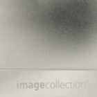 A white background with a large, blurred, dark circle in the upper right area. The text image collection is visible at the bottom against a lighter section of the background.
