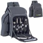 A gray picnic backpack with a front pocket open, revealing neatly arranged cutlery, plates, and four checkered glasses. Theres a bottle holder on each side and a logo that reads Green Creatives. A smaller image shows the backpack fully closed.