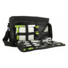 A black zippered picnic bag, open to show its contents. Inside are a cutting board, salt and pepper shakers, a corkscrew, and stainless steel barbecue utensils, including a spatula, fork, and tongs, all secured with elastic straps.