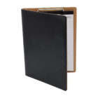 A black leather portfolio binder is slightly open, revealing a lined notepad with visible notes. The interior is tan-colored, and a silver metal clip holds the paper in place. The notepad is positioned vertically within the binder.