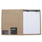 Open tan leather folder with a calculator on the left side, a clear ID slot, and two card slots. On the right, a lined notepad labeled MEMO is attached with a metal clip at the top.