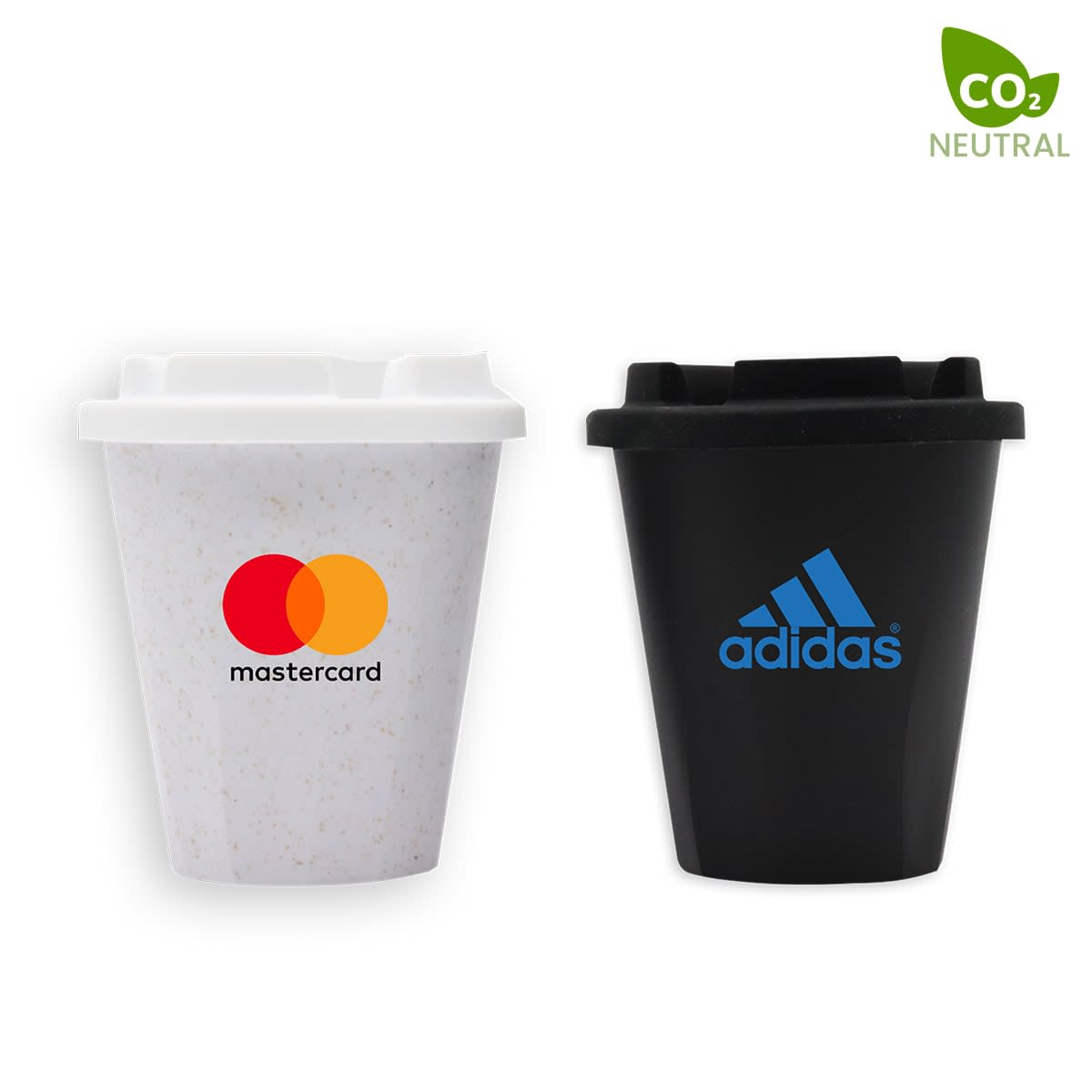 Two reusable coffee cups are shown. The white cup features the Mastercard logo, and the black cup displays the Adidas logo. Both cups have spill-proof lids. A CO2 Neutral label is visible in the top right corner.