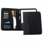 A black portfolio with a calculator, notepad, pen holder, and pockets. One pocket holds a photo and a couple of cards. The cover is half-closed, showing part of the notepad and calculator.