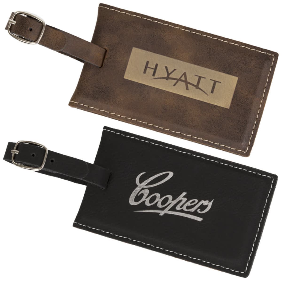 Two leather luggage tags are shown. The brown tag reads HYATT on a metallic label, and the black tag reads Coopers in white cursive. Both have silver buckle straps for attachment.