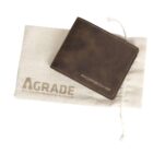 Brown leather wallet with Porsche embossed on it, resting on a white drawstring pouch labeled A Grade with a slogan underneath. The wallet appears to be made from high-quality material.
