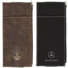 Two leather pouches are displayed: one brown with a Maserati logo and one black with a Mercedes-Benz logo. Both have a sleek, rectangular design with minimal stitching details and a clip at the top.