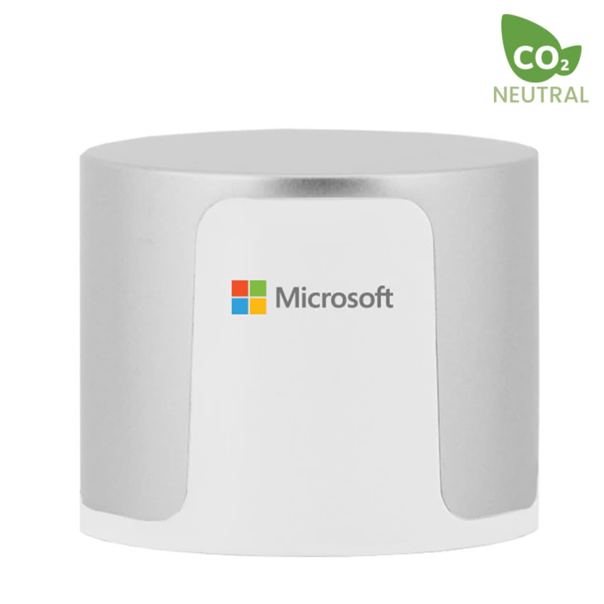 A cylindrical device with a white center and silver top and bottom, featuring the Microsoft logo in the middle. A CO2 Neutral label with a leaf icon is in the top right corner.