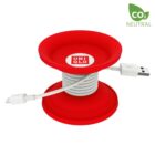 A red, spool-shaped cable organizer with a USB cable wrapped around it, featuring the Uniqlo logo in the center. The top right shows a CO2 Neutral label.