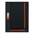 A gift set with a black notebook featuring an orange elastic band, a silver and orange USB drive, and a matching orange pen with silver accents, all arranged neatly in a black box.